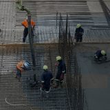 workers pouring concrete slab