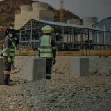 Industrial construction site with busy construction workers